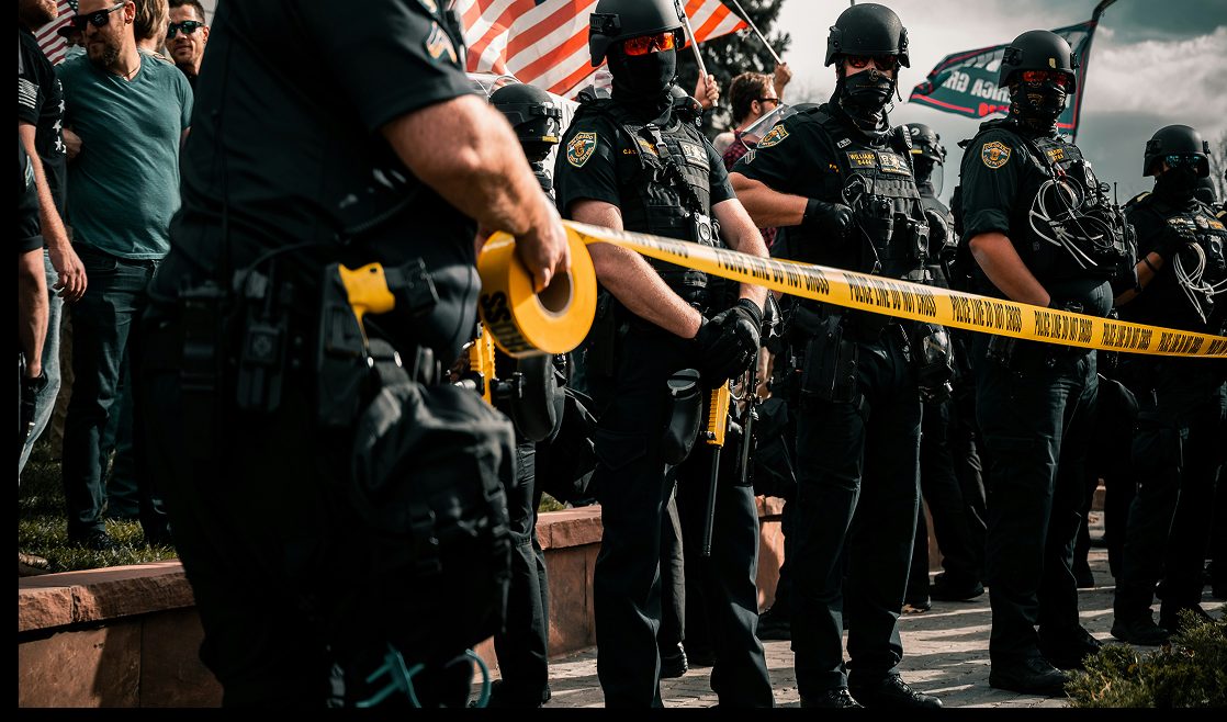 Police officers at a violent crime scene